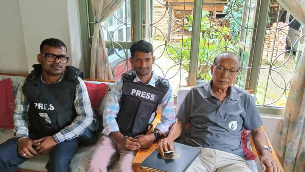 Rajan Chaudhary and colleague Satya Prakash Bharti with Muolvaiphei Village's second head Lalzarlien Darngawn (85).