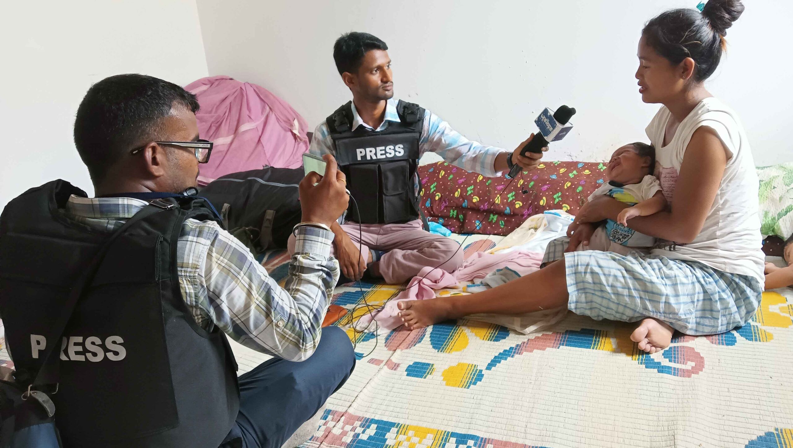 Rajan Chaudhary and his colleague Satya Prakash Bharti interviewing a Kuki woman at a relief camp in Churachandpur district of Manipur.