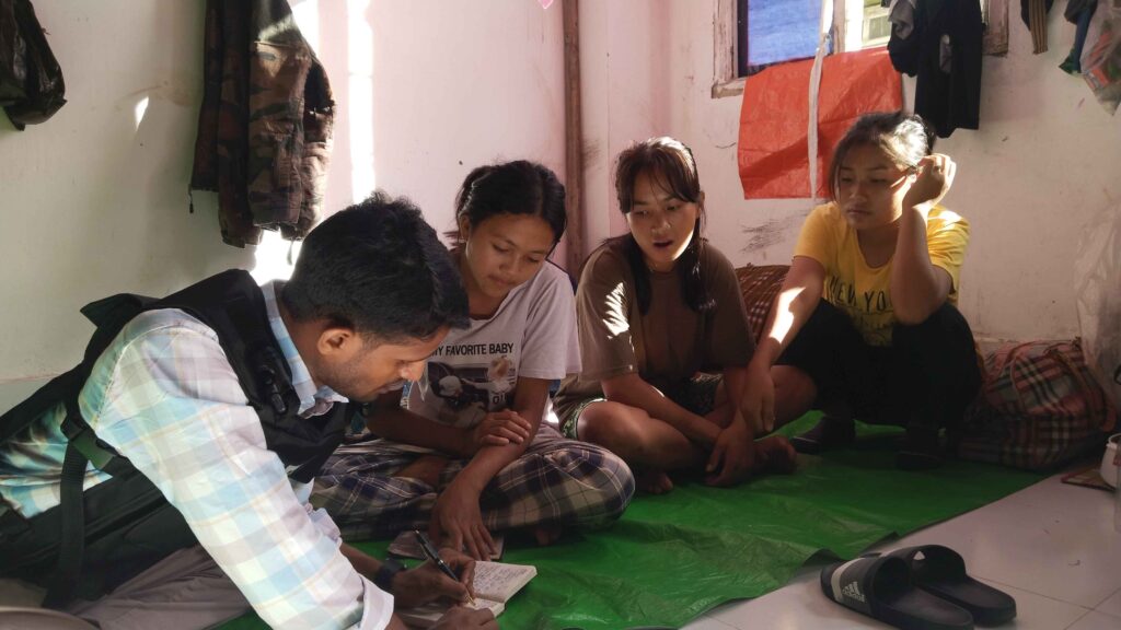 Rajan Chaudhary and his colleague Satya Prakash Bharti interviewing schoolgirls from the Kuki-Zo community at a relief camp in Churachandpur district of Manipur.